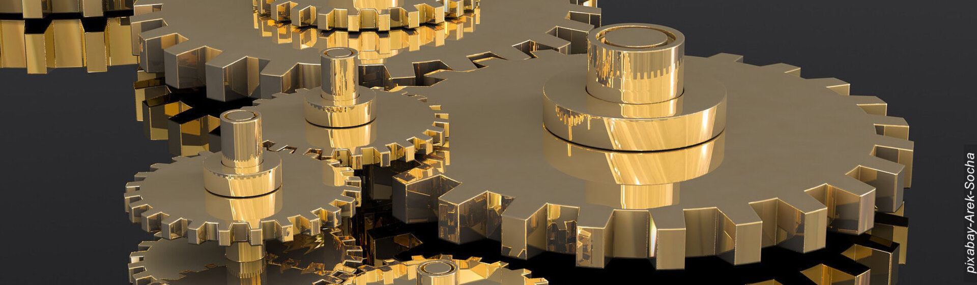 Goldene Zahnräder greifen ineinander. Goldene Zahnräder greifen ineinander.